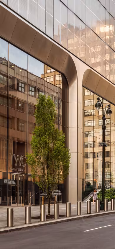 Two Manhattan West, a BGRE office building in Midtown Manhattan, New York City, featuring modern glass façades, a pedestrian-friendly streetscape and premier office space.