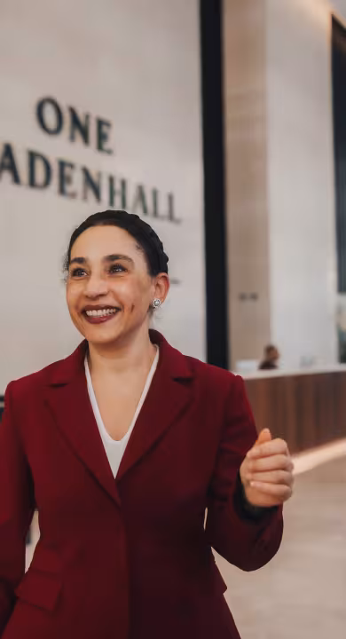 A BGRE colleague conversing with tenants in the lobby of One Leadenhall, a modern office building in the City of London 