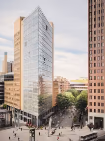A BGRE office building overlooking an urban plaza and tree-lined streets.